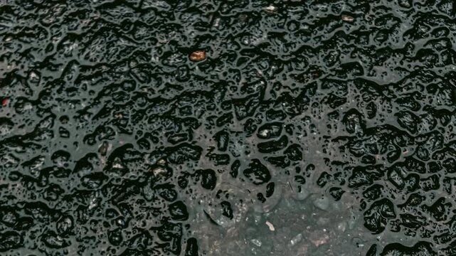Wet asphalt texture with abstract patterns