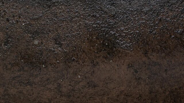 Dark wet concrete ground texture
