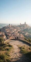 Obraz premium Hilltop viewpoint overlooking terracotta‑roof town and cathedral domes at sunrise — travel and landscape