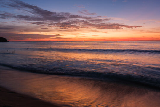 Natural seaside scenery of Kata Beach at sunset with afterglow in Phuket, Thailand