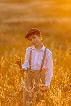 Sweet preteen child, boy, playing in a field on sunset with kite and old vingate car, walking with grandmother in the countryside