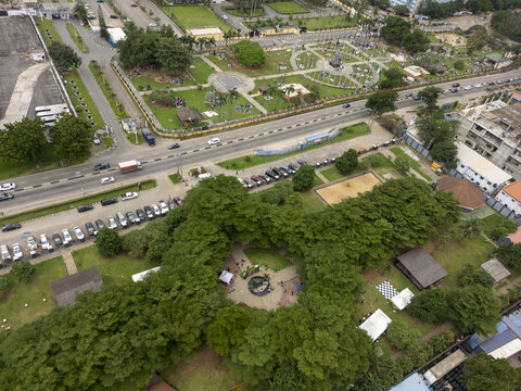 Aerial view of Johnson Jakande Tinubu Park featuring lush green trees, paved walkways, and surrounding urban infrastructure in Ikeja, Lagos, Nigeria.