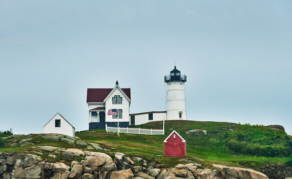 the iconic Cape Neddick Lighthouse (built 1879), also known as Nubble Light, located on a small rocky islet off the coast of York, Maine, New England