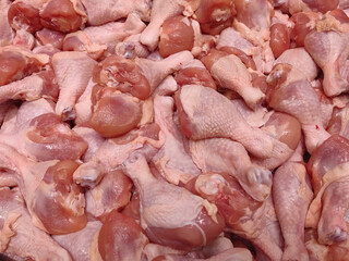 Raw chicken leg or drumstick background © Jira