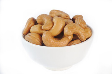 Fototapeta premium salted cashew nut in white bowl
