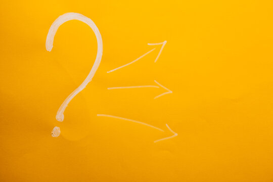 Question mark on a yellow background. The concept of questions and answers.