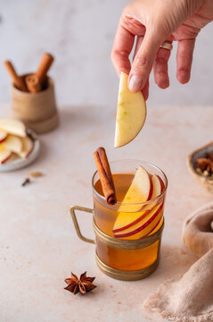 Making hot apple cider with fresh apples, autumn drink lifestyle
