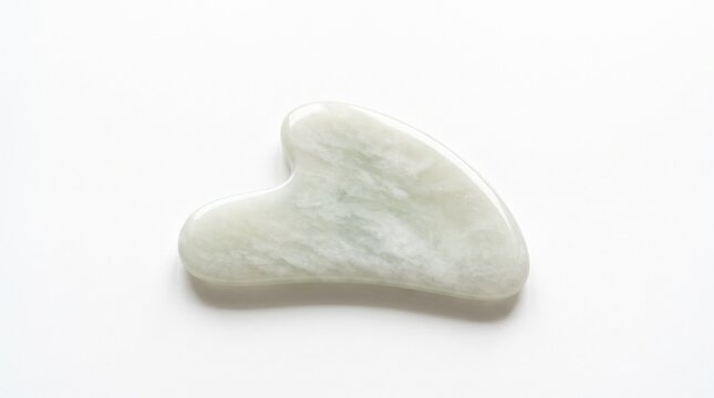 Natural jade gua sha stone for facial massage, traditional Chinese medicine skincare tool, polished green quartz scraper for beauty wellness isolated PNG with Transparent Background