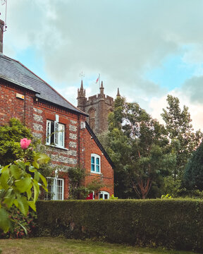 Cerne Abbas Village Church Framed by Traditional Cottages, Dorset, England