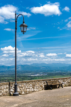 A Seat with a View
A quiet bench and a classic streetlamp looking out over sweeping valley views and distant snow-capped mountains at Piazza della Vittoria in Artena. 🏔️🌤️