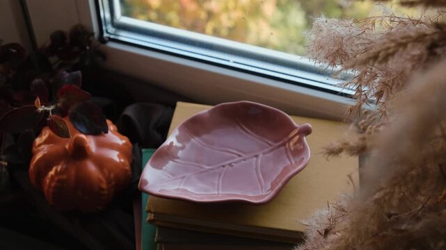Autumn vibes. Woman relaxing drinking cocoa near window. Warm cozy fall mood. 