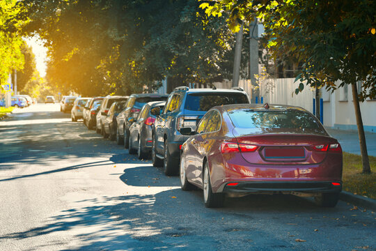 Densely packed parking lot in the city with rows of cars filling every available spot, severe shortage of free space and the challenges of urban vehicle storage during peak hours, crowded parking area