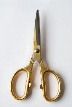 Precision and craftsmanship concept, gold scissors for tailoring and creative design work isolated on a clean white background for professional use