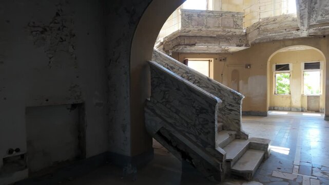 Getting up marble stairs on an abandoned villa
