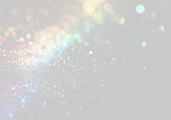 A vibrant array of multicolored bokeh lights scatters across a dark background. The lights create a dense, shimmering field with varied sizes and soft focus. © Romstock