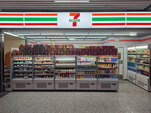 Shanghai, China-Dec.27th 2025: 7-Eleven convenience store in subway station. Food display shelves under the brand sign