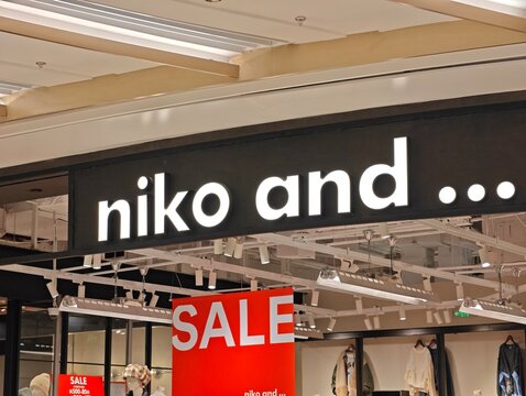 Shanghai,China-Dec.27th 2025: niko and ... brand logo store sign