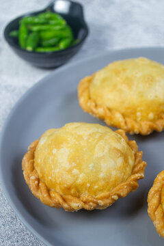 Delicious homemade Indonesian street food pasteluUfo isi bihun served on a grey plate