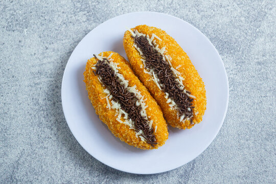 pisang goreng sandwich, sweet fried banana sandwich coated in bread crumbs, filled with cheese and chocolate