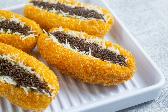 pisang goreng sandwich, sweet fried banana sandwich coated in bread crumbs, filled with cheese and chocolate