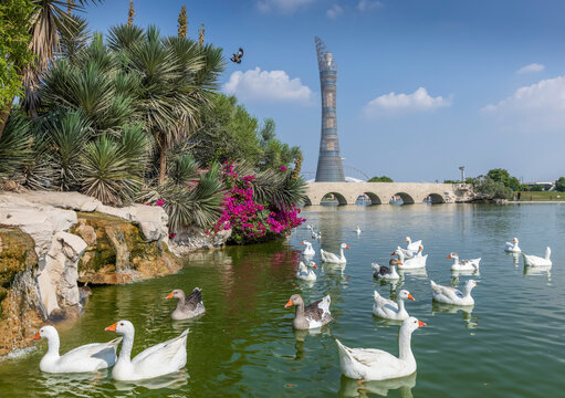 The Torch Tower skyline seen from the lush green oasis of Aspire Park in Doha
