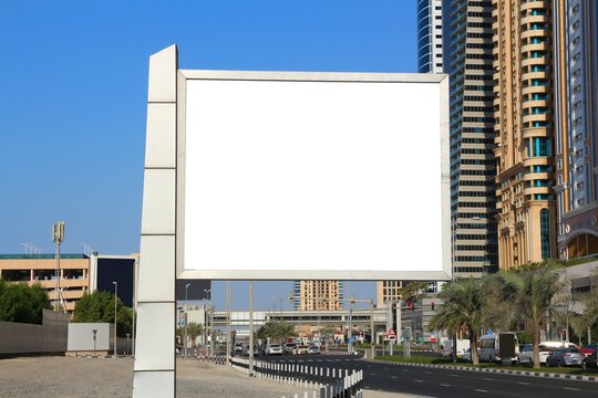 Blank billboard ad. Empty white advertisement with copy space in a big city. Dubai, United Arab Emirates.