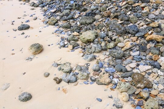 Beach in the Philippines. Sandy beach in Palawan island, with fossilized coral and colorful stones.