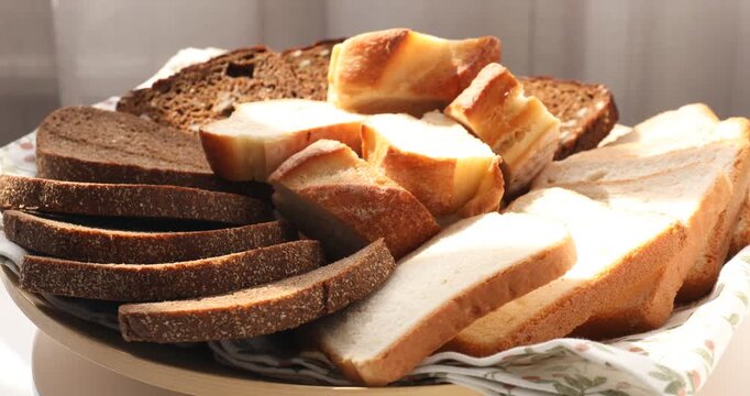 Different types of bread on table indoors, closeup