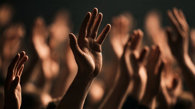 Hands raised in worship signify faith and healing during lent and easter celebrations in a gathering