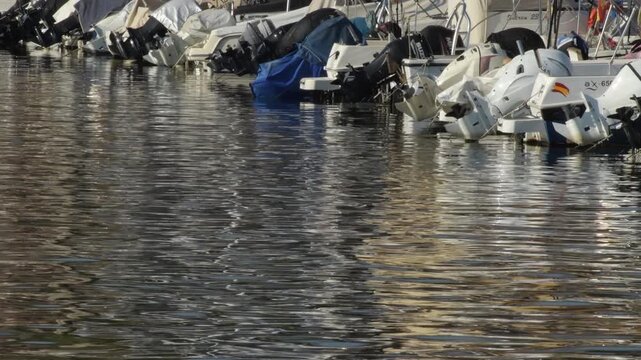 Row of recreational pleasure boats docked at the marina