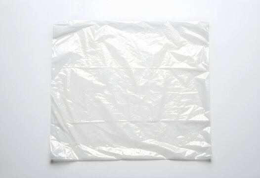 Plastic pollution and environmental waste, empty transparent polyethylene bag for recycling and sustainability concept isolated on a clean white background