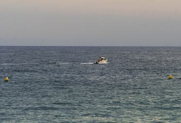 Small Boat Sailing on the Calm Mediterranean Sea © helena