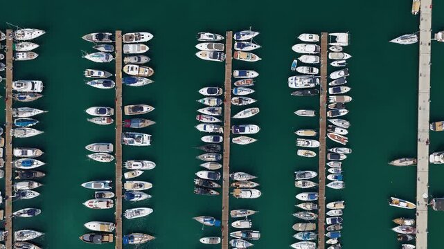Top Down Aerial View of Docked Yachts and Sailboats at Gouvia Marina Pier in Corfu, Greece