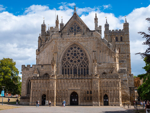The stone Gothic west front of Exeter Cathedral in Devon, England - "one of the great architectural features of Medieval England" with circular stained glass West Window.