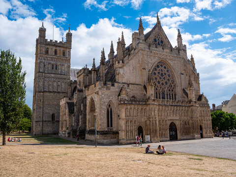 The stone Gothic west front of Exeter Cathedral in Devon, England - "one of the great architectural features of Medieval England" with circular stained glass West Window.