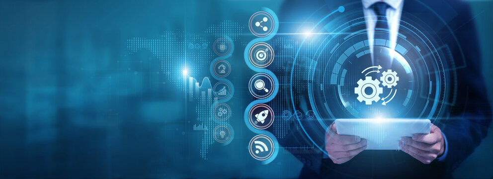 Businessman using tablet analyzing Automation and process data, monitoring smart systems, optimizing workflows, improving operational efficiency and reducing manual tasks