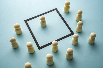 Obraz premium Concept of property, understood in both legal and social terms, represented by wooden tokens on a blue background.