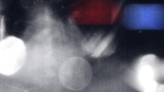 Abstract blurry red and blue emergency police car lights at night