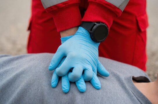 A medical professional performing chest compressions on a person in a life-saving emergency rescue.