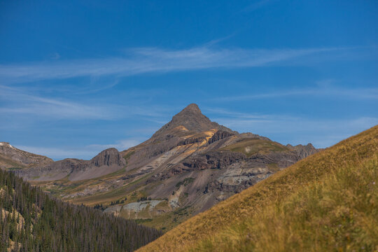 Wetterhorn Peak in early autumn with wispy clouds