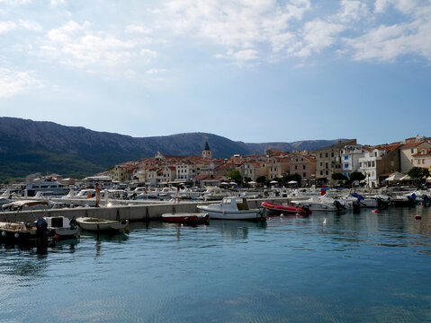 Boats moored in the harbor in the town of Baska, Croatia