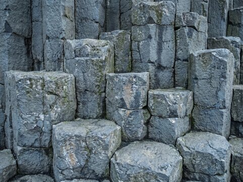 Natural hexagonal basalt column rock formation texture close up