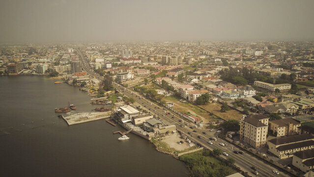 Aerial view of Lekki Phase 1 featuring residential buildings, waterfront properties, and a coastal road in Lekki, Lagos, Nigeria.