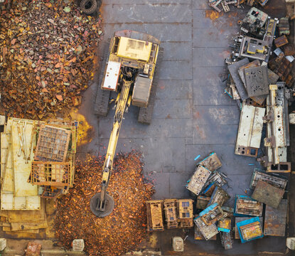 Electromagnetic Crane Sorting Metal at Recycling Yard