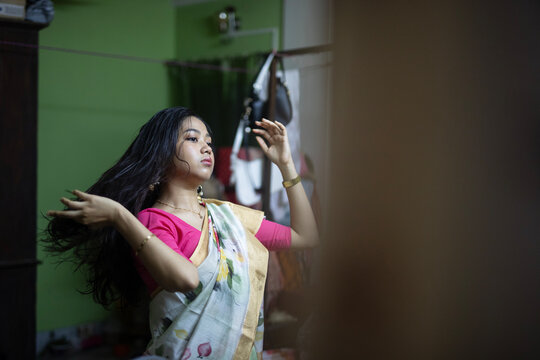 Indian woman wearing sari dress at indoors