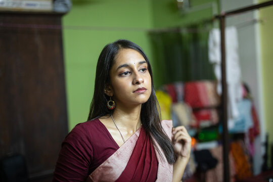 Indian woman wearing sari dress at indoors