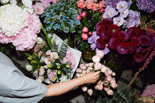 Woman Selecting Flowers at a Flower Shop