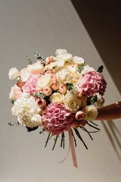 Florist holding a Fresh Mixed Flower Bouquet