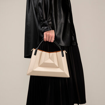 Black Leather Coat With Beige Geometric Handbag