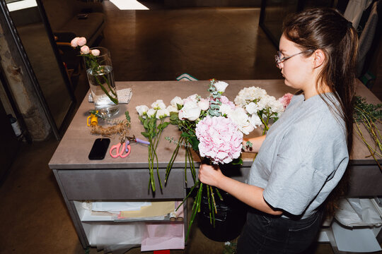 Florist arranging a flower bouquet